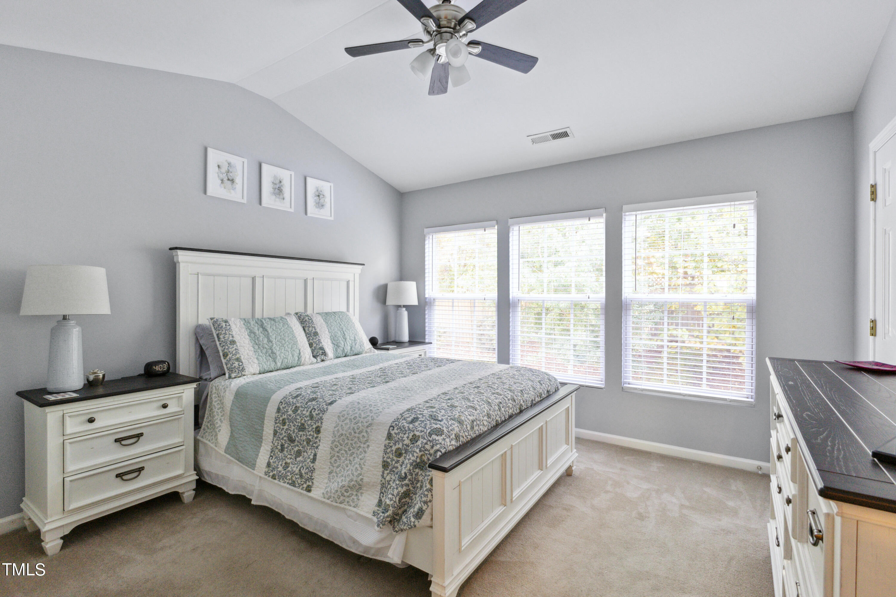 1824 Natalie Brook Way Raleigh, NC 27609 - Photo 15 of 28 a bedroom with a bed and a window