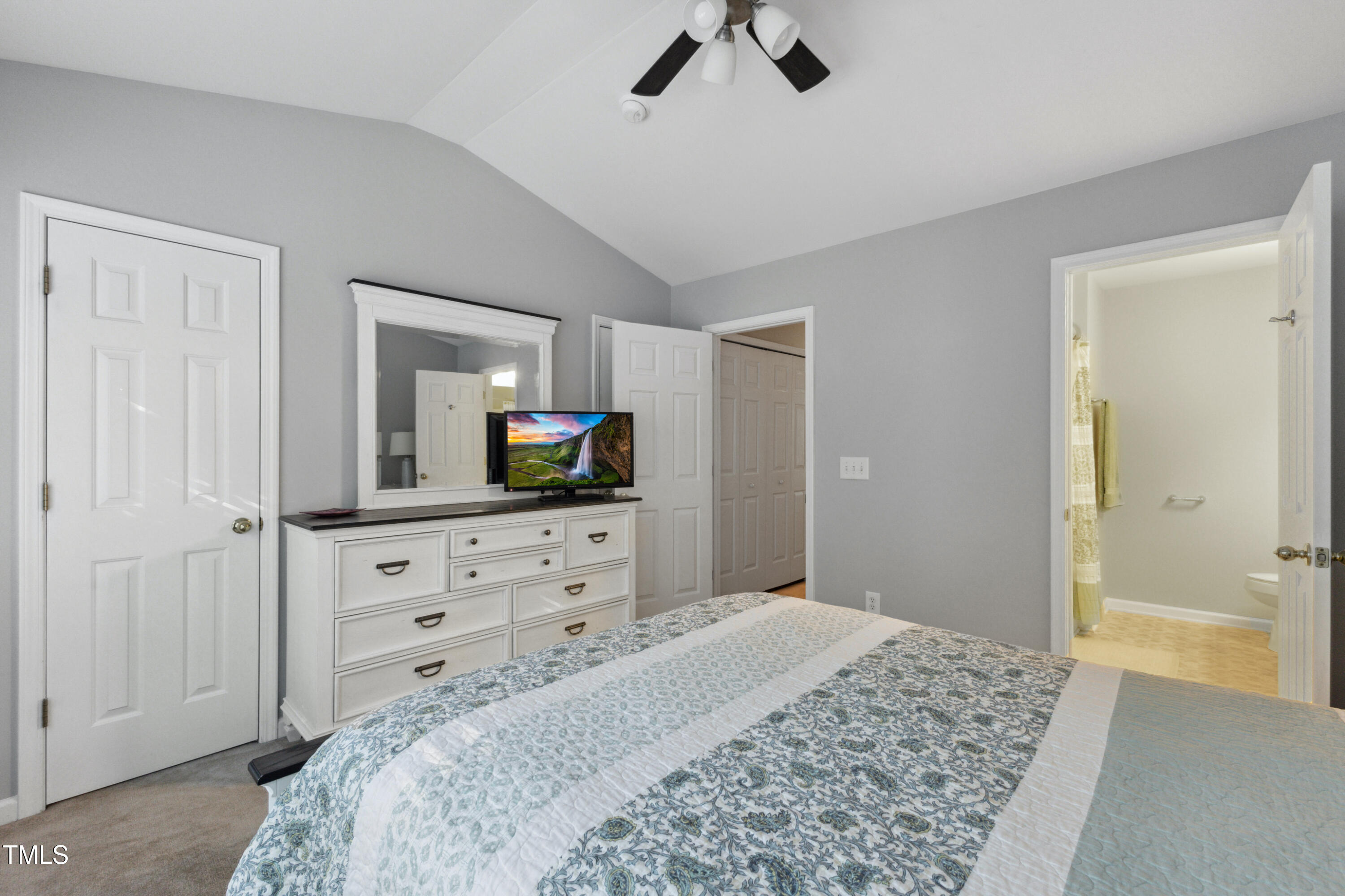 1824 Natalie Brook Way Raleigh, NC 27609 - Photo 16 of 28 a bedroom with a bed and a dresser