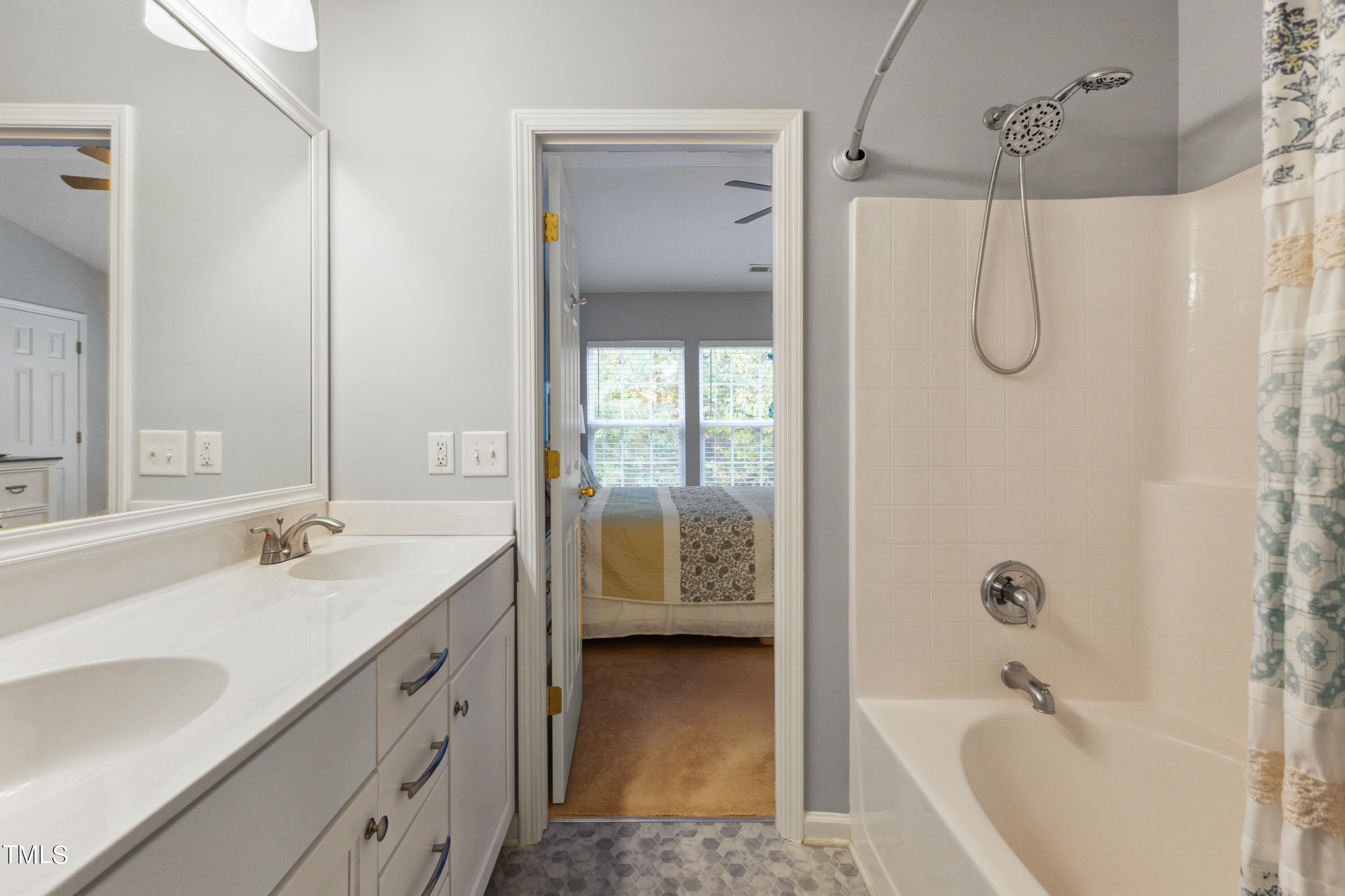 1824 Natalie Brook Way Raleigh, NC 27609 - Photo 19 of 28 a bathroom with a granite countertop bathtub shower sink vanity and mirror