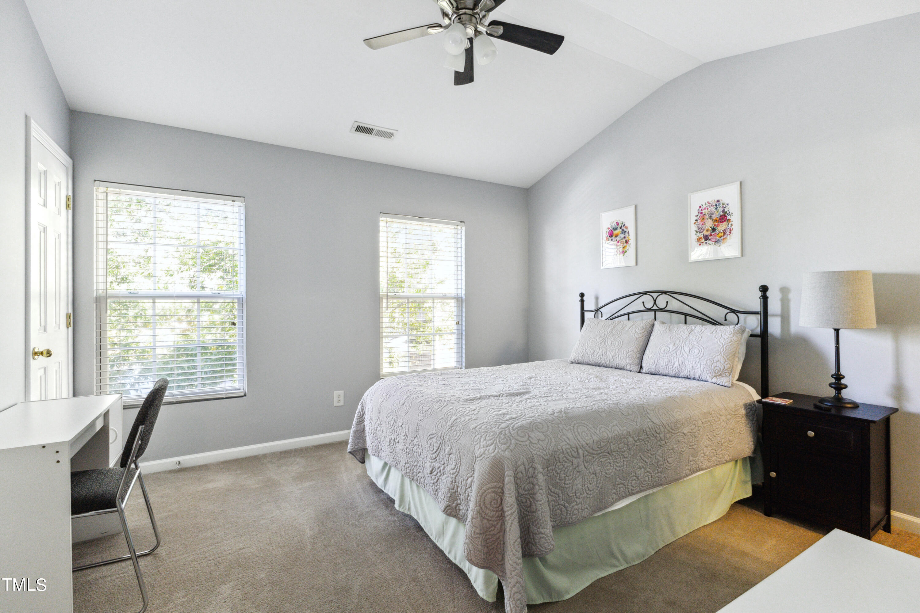 1824 Natalie Brook Way Raleigh, NC 27609 - Photo 20 of 28 a bedroom with a bed and a chair