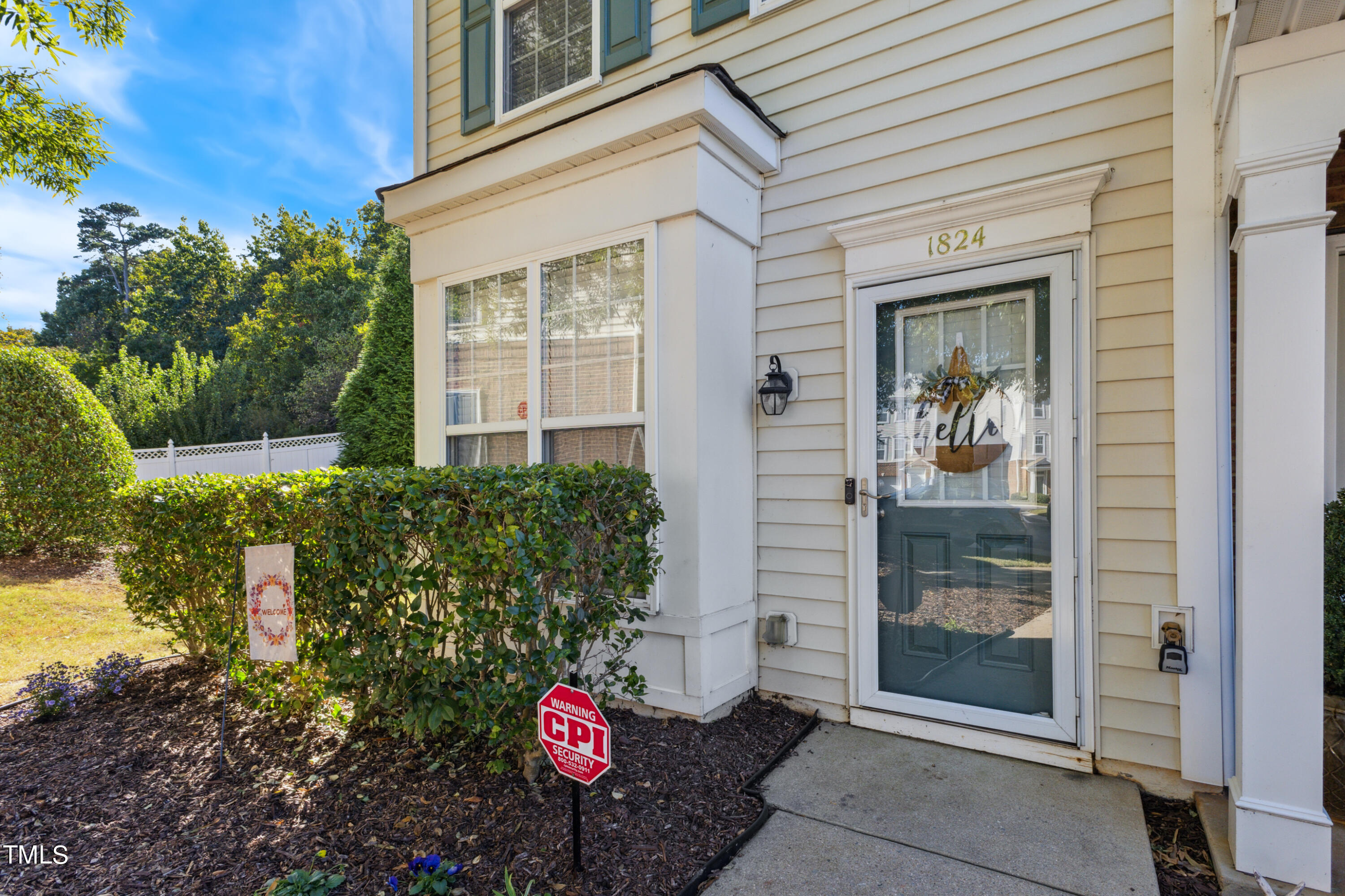 1824 Natalie Brook Way Raleigh, NC 27609 - Photo 2 of 28 a front view of a house with a garden