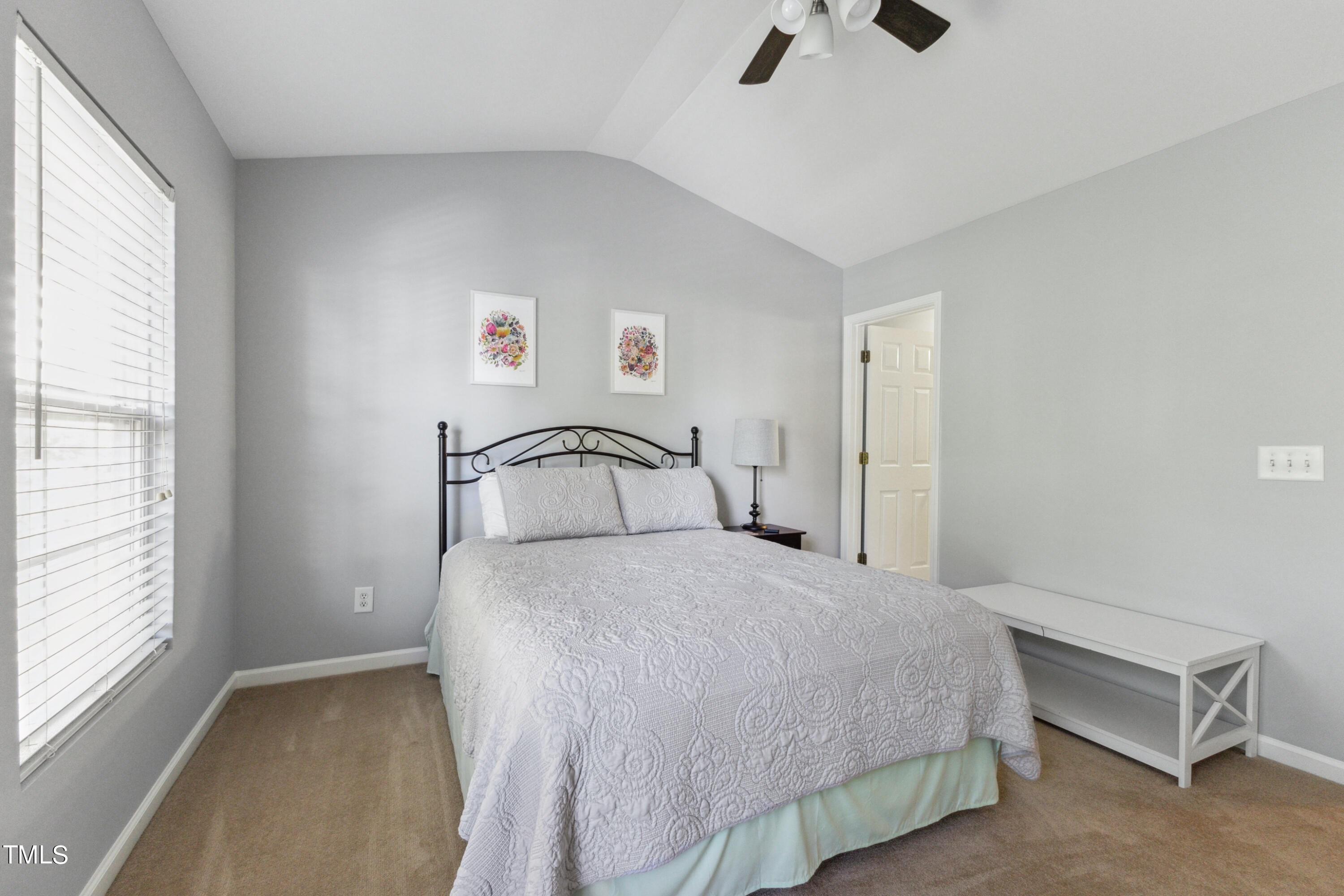 1824 Natalie Brook Way Raleigh, NC 27609 - Photo 21 of 28 a bedroom with a bed and a window