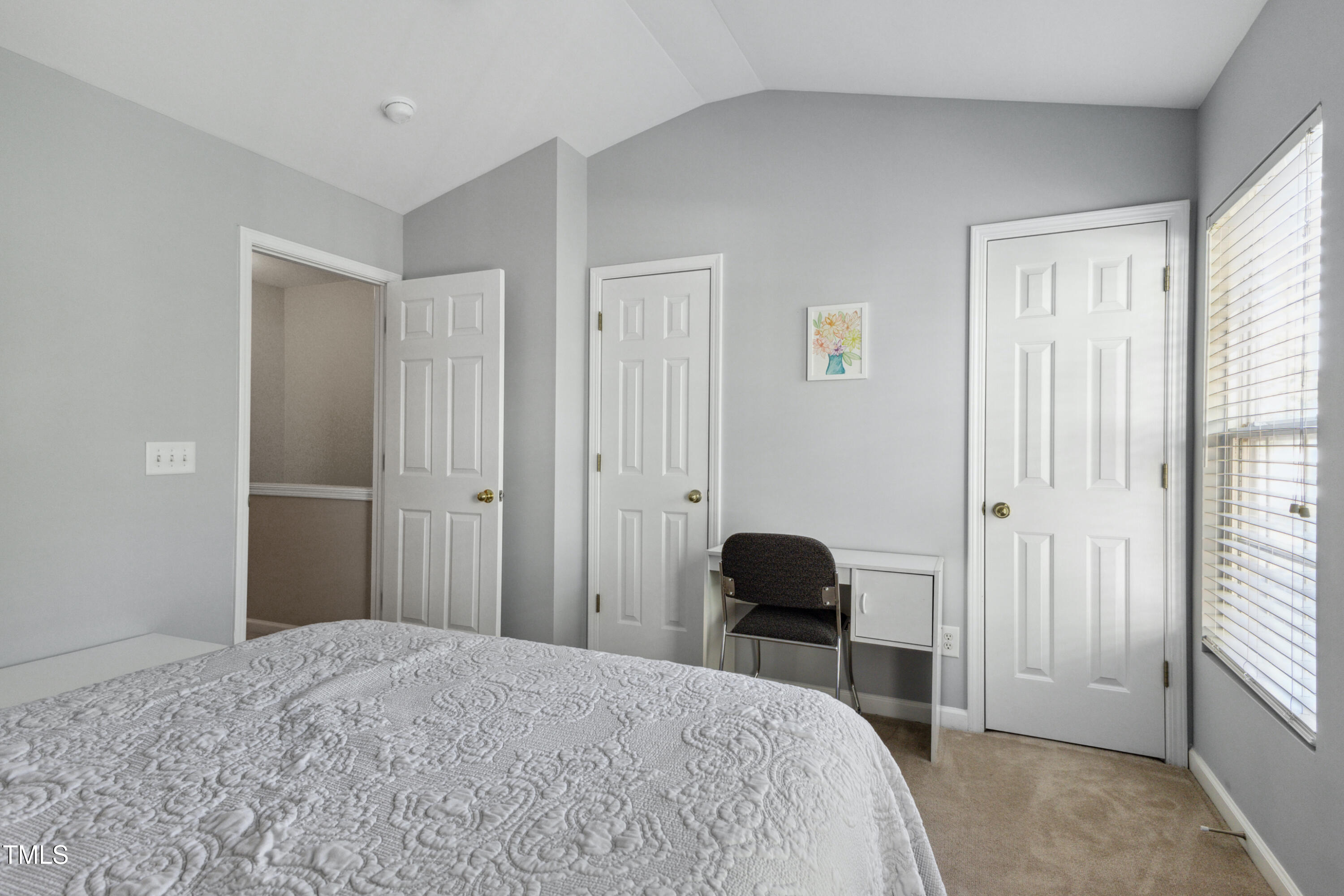 1824 Natalie Brook Way Raleigh, NC 27609 - Photo 22 of 28 a bedroom with a bed and a chair