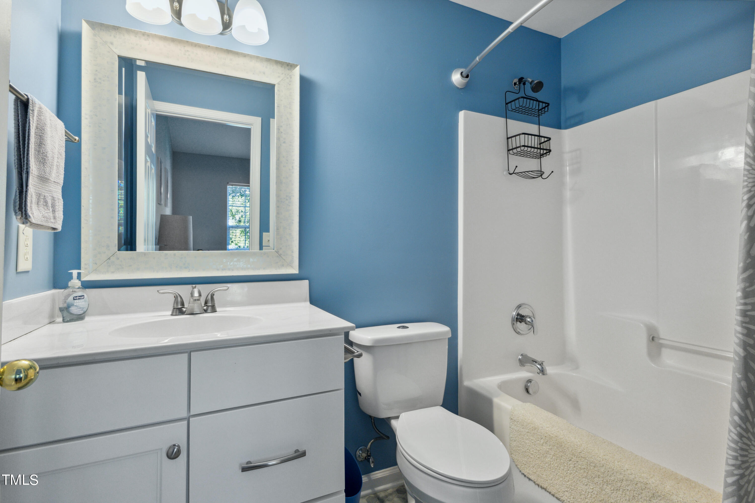1824 Natalie Brook Way Raleigh, NC 27609 - Photo 24 of 28 a bathroom with a sink toilet and shower