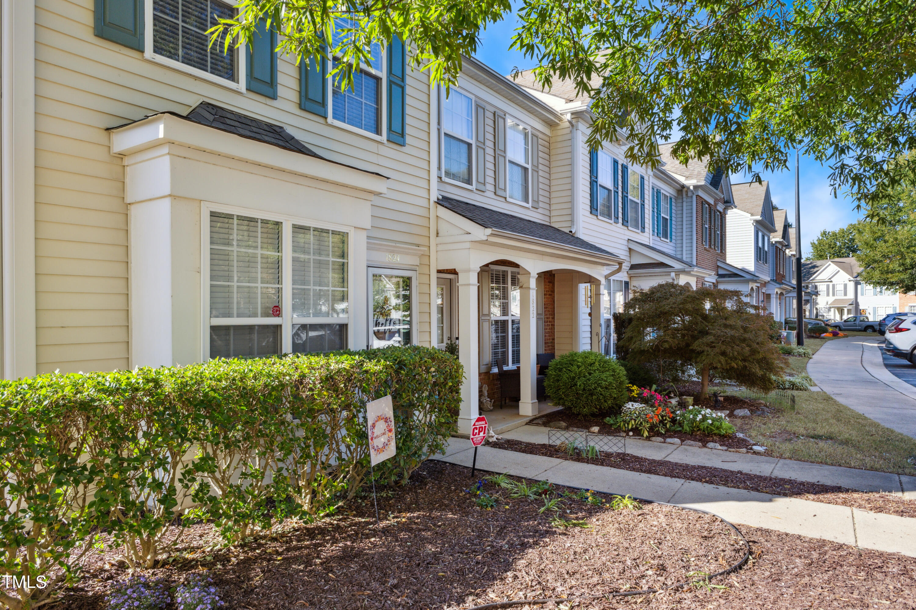 1824 Natalie Brook Way Raleigh, NC 27609 - Photo 3 of 28 a view of a house with a garden