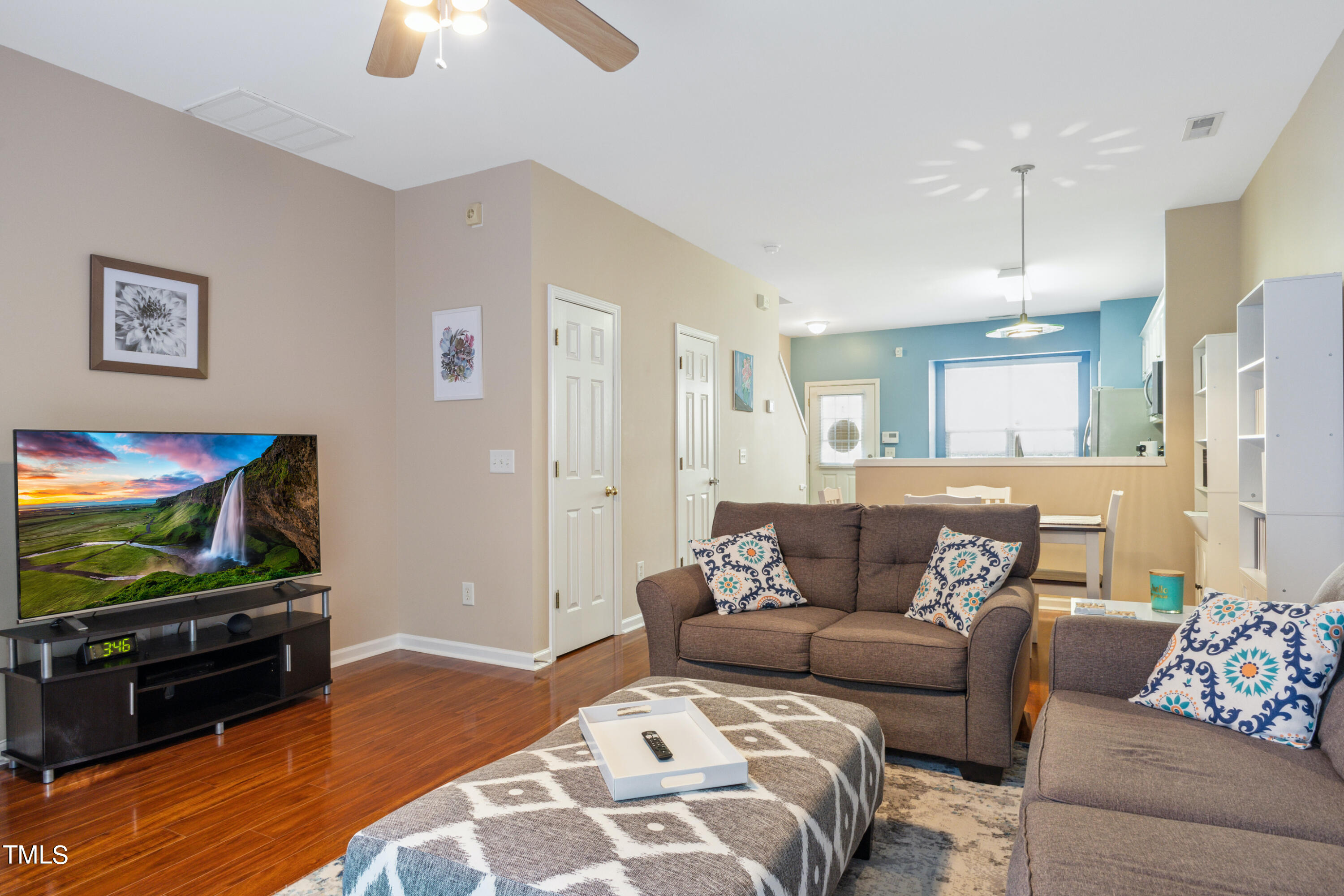 1824 Natalie Brook Way Raleigh, NC 27609 - Photo 6 of 28 a living room with furniture and a flat screen tv