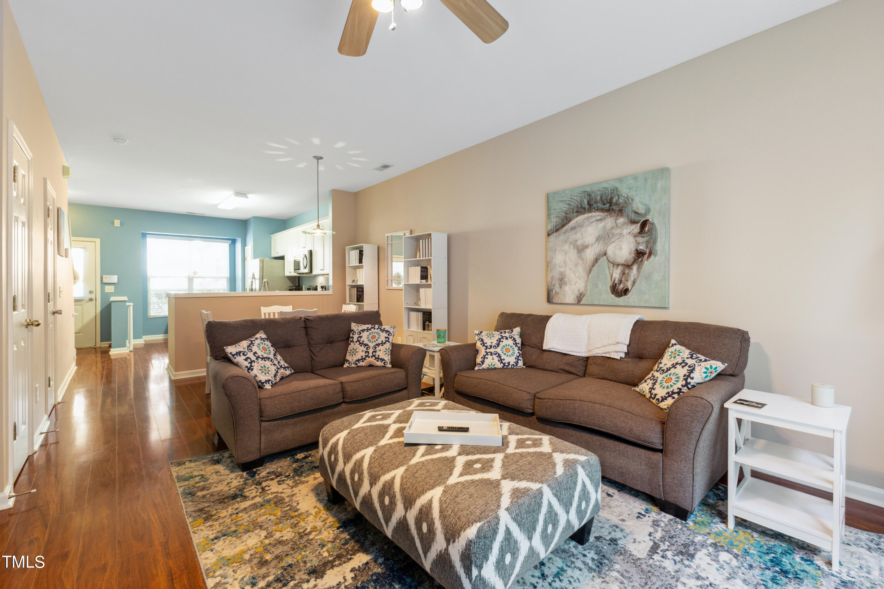 1824 Natalie Brook Way Raleigh, NC 27609 - Photo 7 of 28 a living room with furniture and a wooden floor
