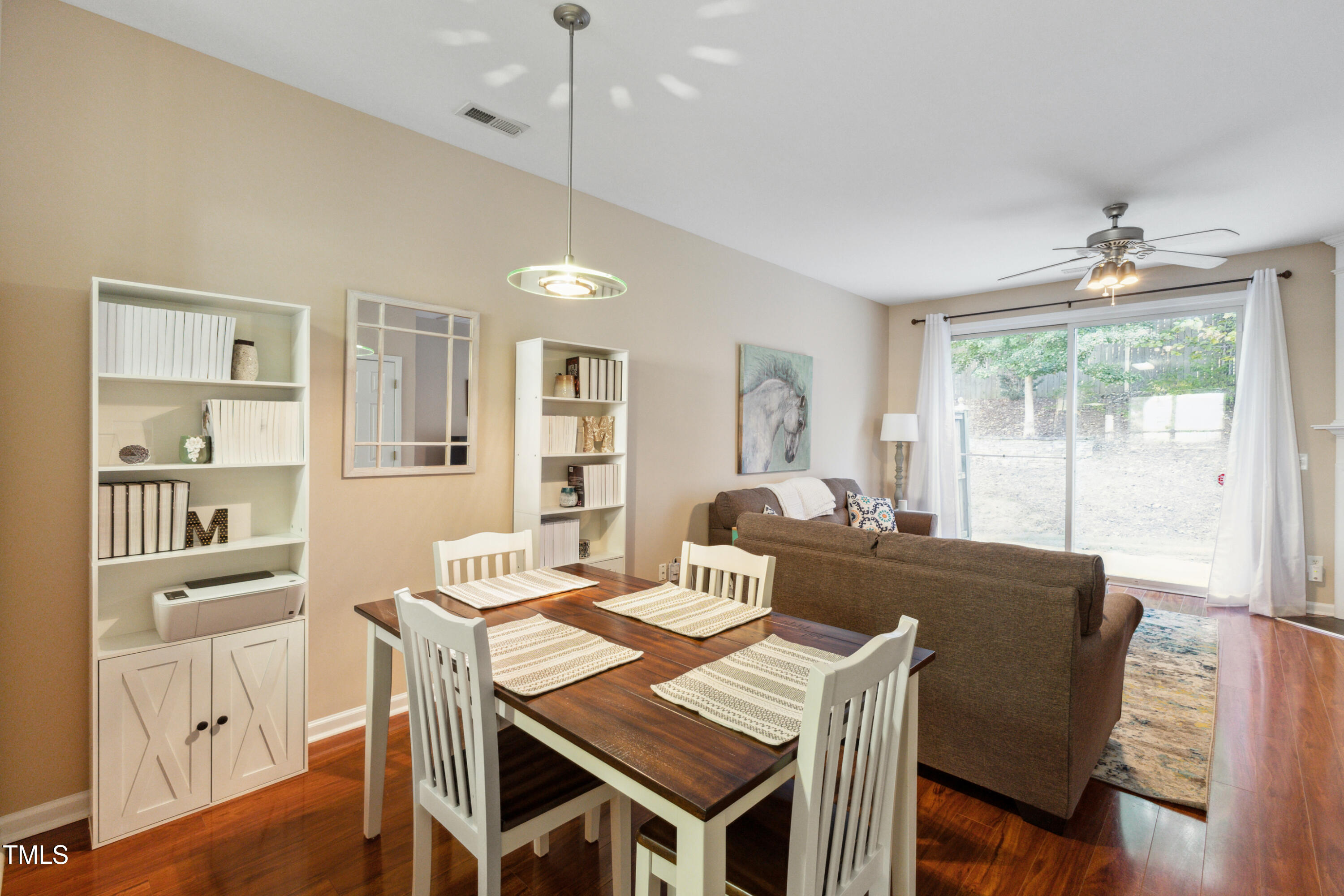 1824 Natalie Brook Way Raleigh, NC 27609 - Photo 8 of 28 a view of a dining room with furniture window and wooden floor