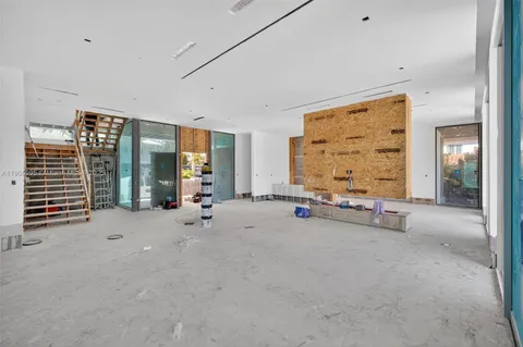 a view of a lake with tables and chairs