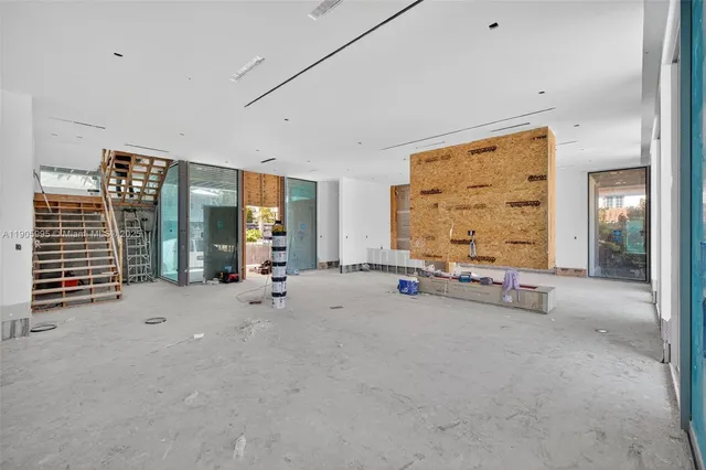a view of a lake with tables and chairs