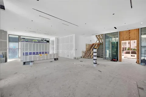 a view of a chairs and table in a balcony