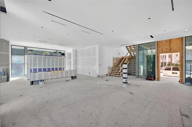a view of a chairs and table in a balcony