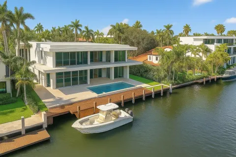 a view of a house with swimming pool and porch