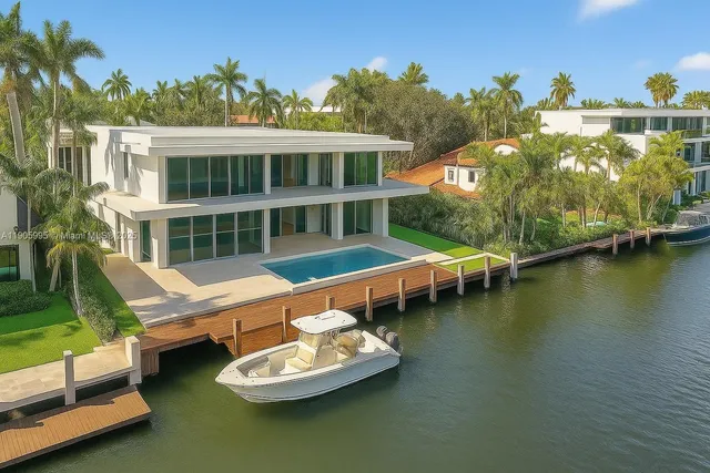 a view of a house with swimming pool and porch