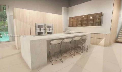 a en suite bathroom with a sink and a large mirror