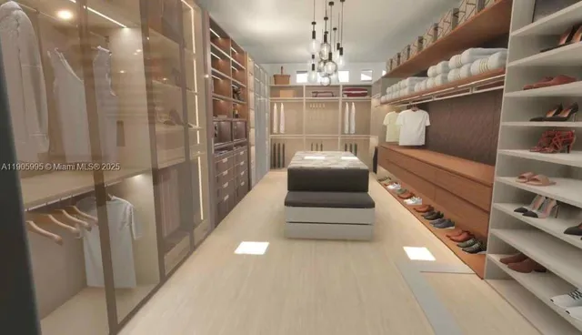 an aerial view of a house with a yard and lake view