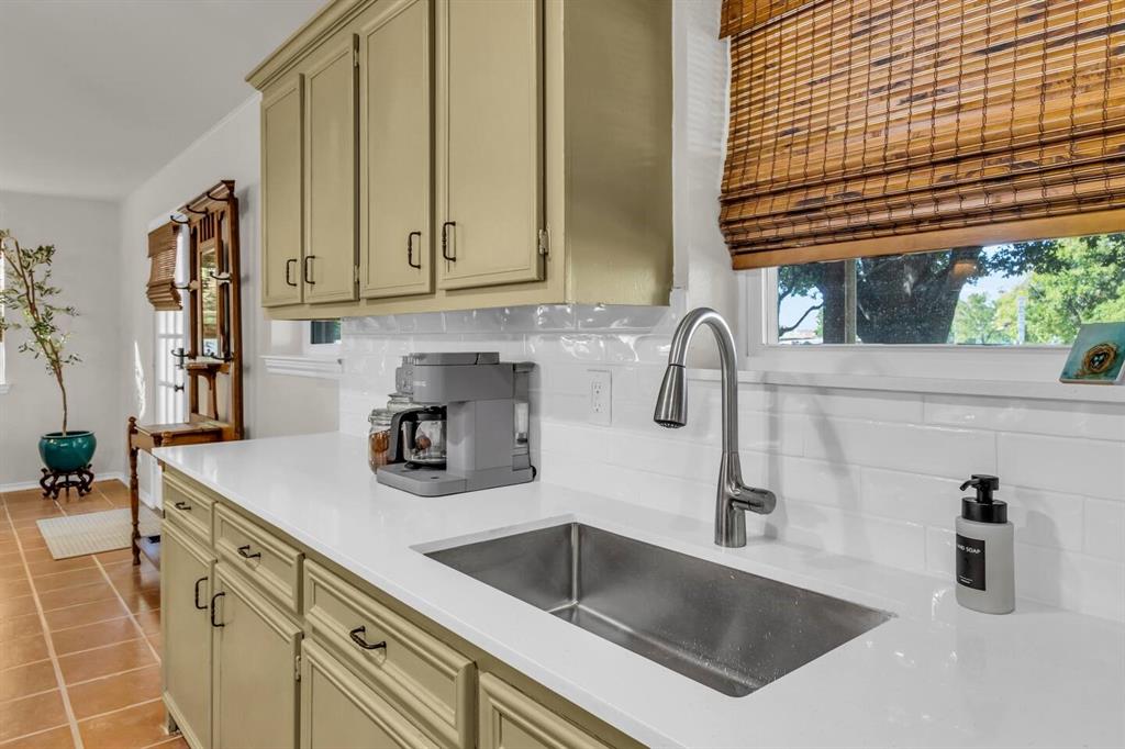 9780 North County Road Frisco, TX 75033 - Photo 11 of 36 a kitchen with sink and cabinets