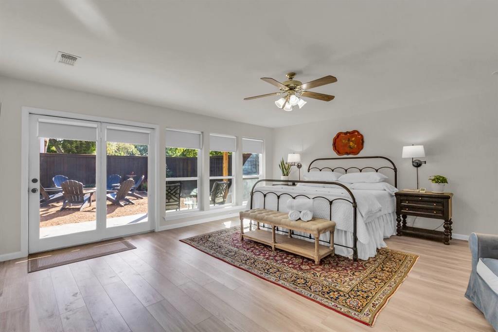 9780 North County Road Frisco, TX 75033 - Photo 17 of 36 a bed sitting in a bedroom next to a window