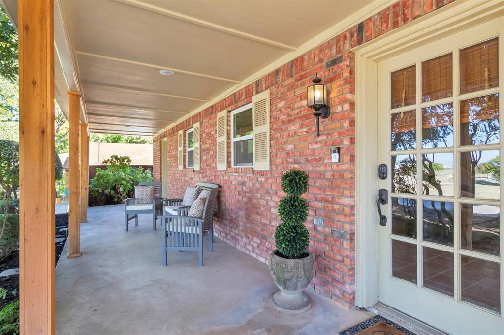 9780 North County Road Frisco, TX 75033 - Photo 2 of 36 a view of a porch with chairs and potted plants
