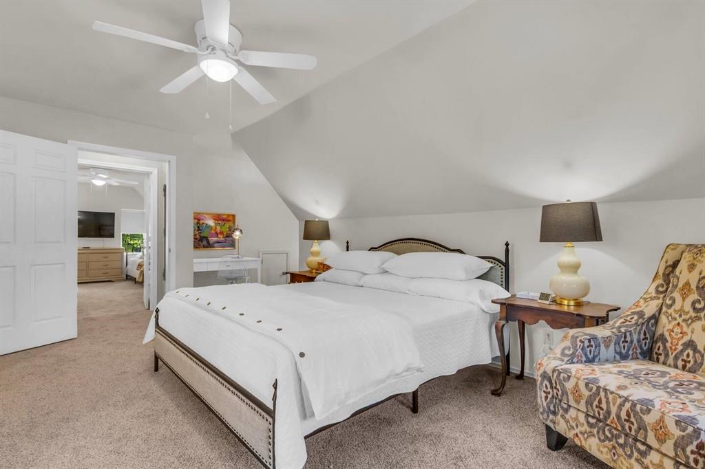 9780 North County Road Frisco, TX 75033 - Photo 23 of 36 a bedroom with a bed and a chandelier