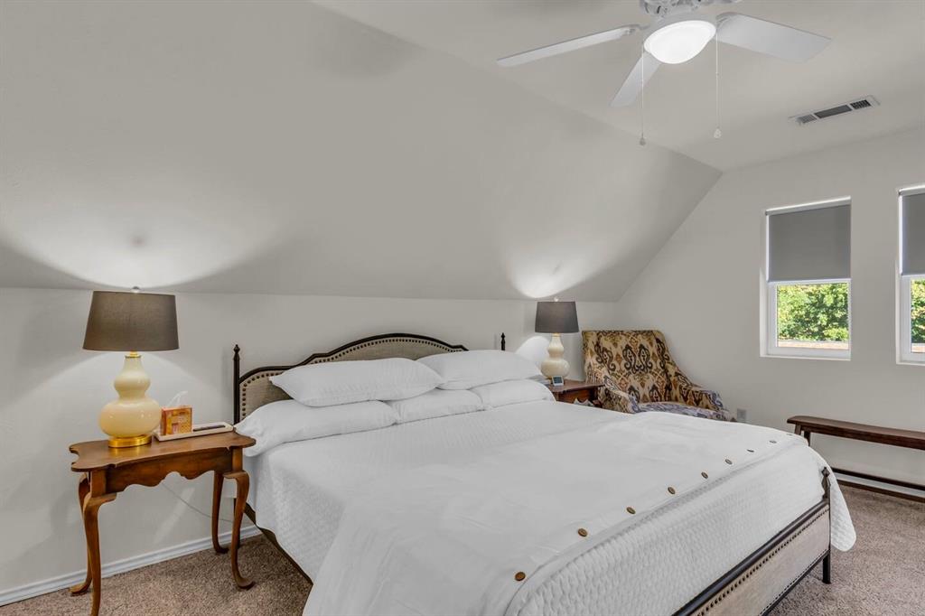 9780 North County Road Frisco, TX 75033 - Photo 24 of 36 a bedroom with a bed and a lamp