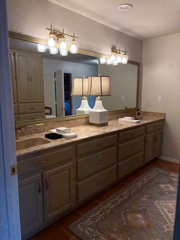9780 North County Road Frisco, TX 75033 - Photo 29 of 36 a bathroom with a sink and a mirror