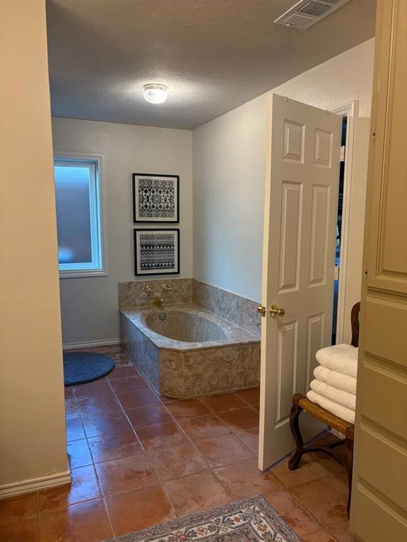 9780 North County Road Frisco, TX 75033 - Photo 30 of 36 a view of a bedroom with wooden floor and a window