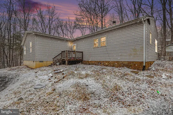 a view of a house with backyard and chair