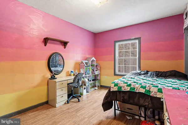 a living room filled with furniture and a flat screen tv