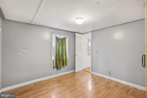 a bathroom with a sink and mirror with toilet