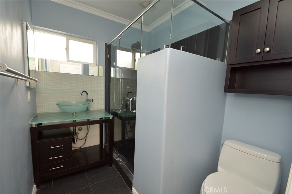 12301 Rives Avenue Downey, CA 90242 - Photo 10 of 20 a bathroom with a toilet and a sink