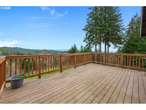 a view of wooden deck with a lake view