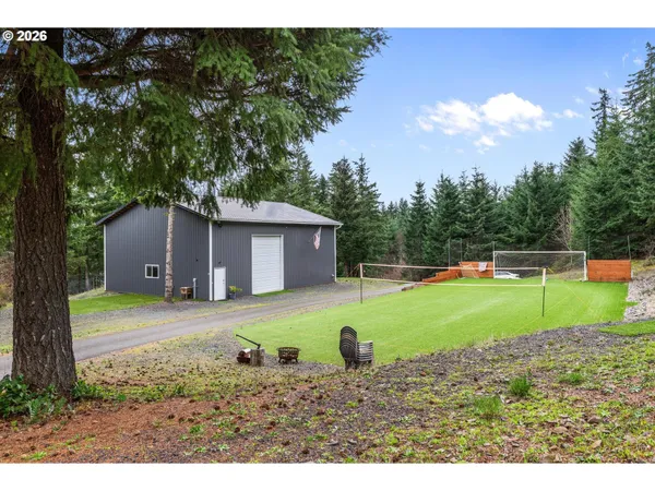 a view of a backyard with a barn