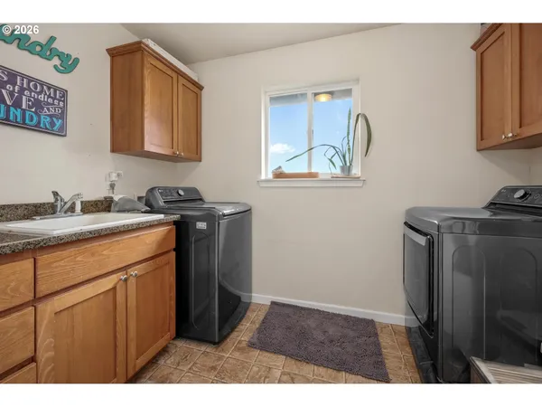 a utility room with closet dryer and washer