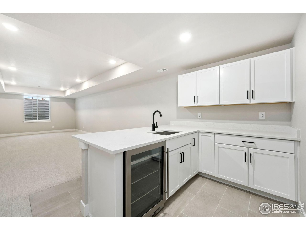 1426 Alyssa Drive Timnath, CO 80547 - Photo 12 of 15 a kitchen with white cabinets appliances and sink