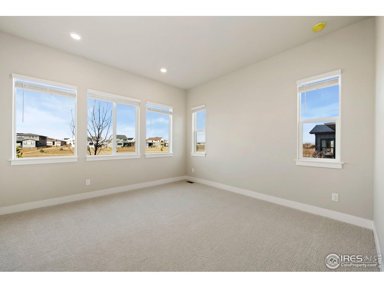 1426 Alyssa Drive Timnath, CO 80547 - Photo 6 of 15 a view of an empty room with a window