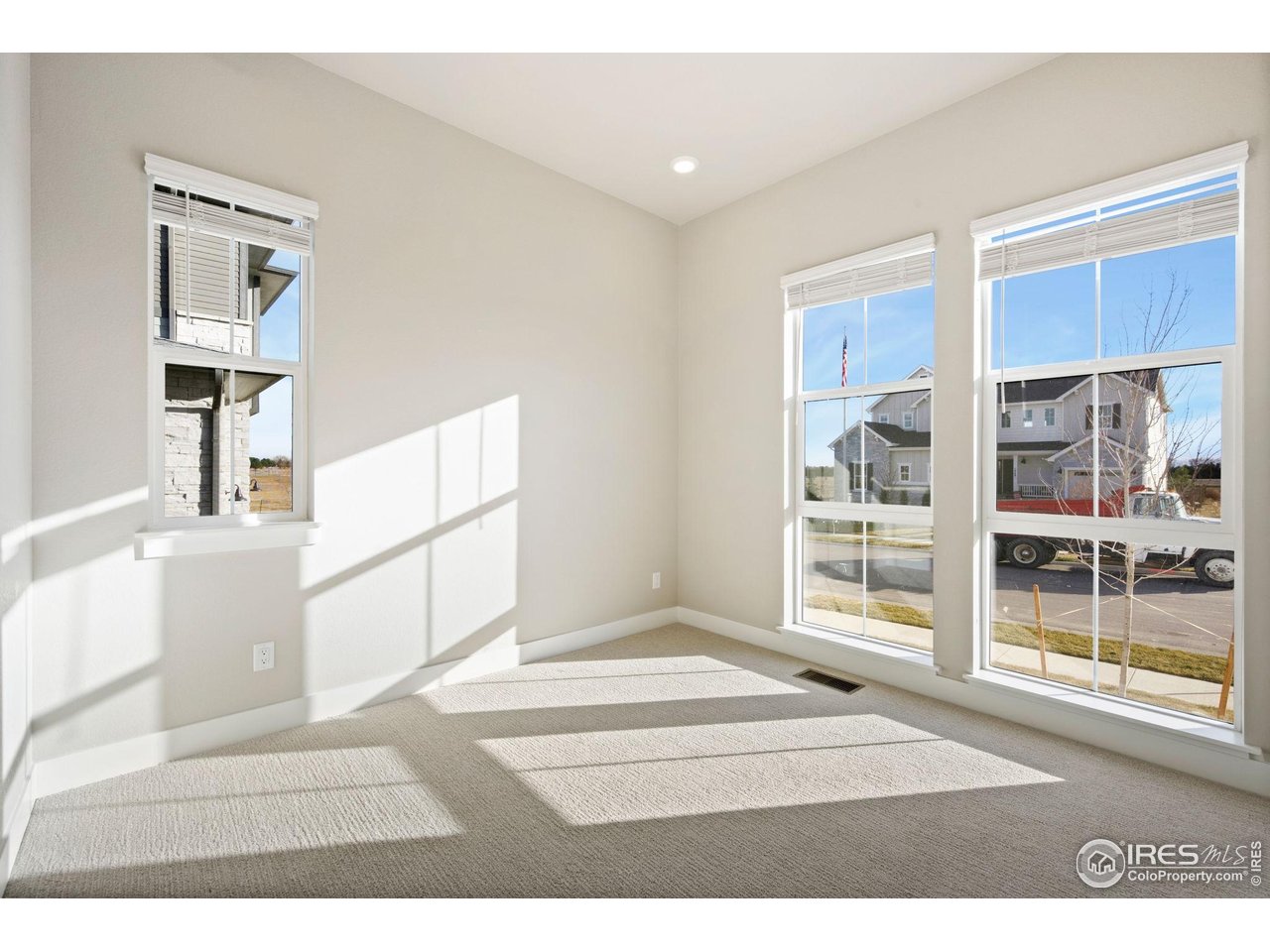 1426 Alyssa Drive Timnath, CO 80547 - Photo 8 of 15 a black white and white photo of a living room