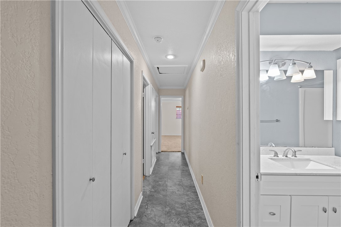 1305 Harbor Lights Drive Corpus Christi, TX 78412 - Photo 14 of 31 a bathroom with a sink and a mirror