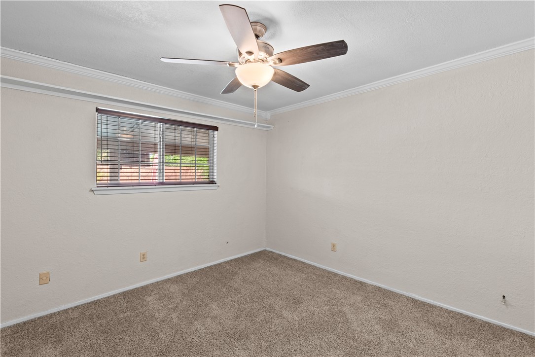 1305 Harbor Lights Drive Corpus Christi, TX 78412 - Photo 18 of 31 an empty room with ceiling fan and window