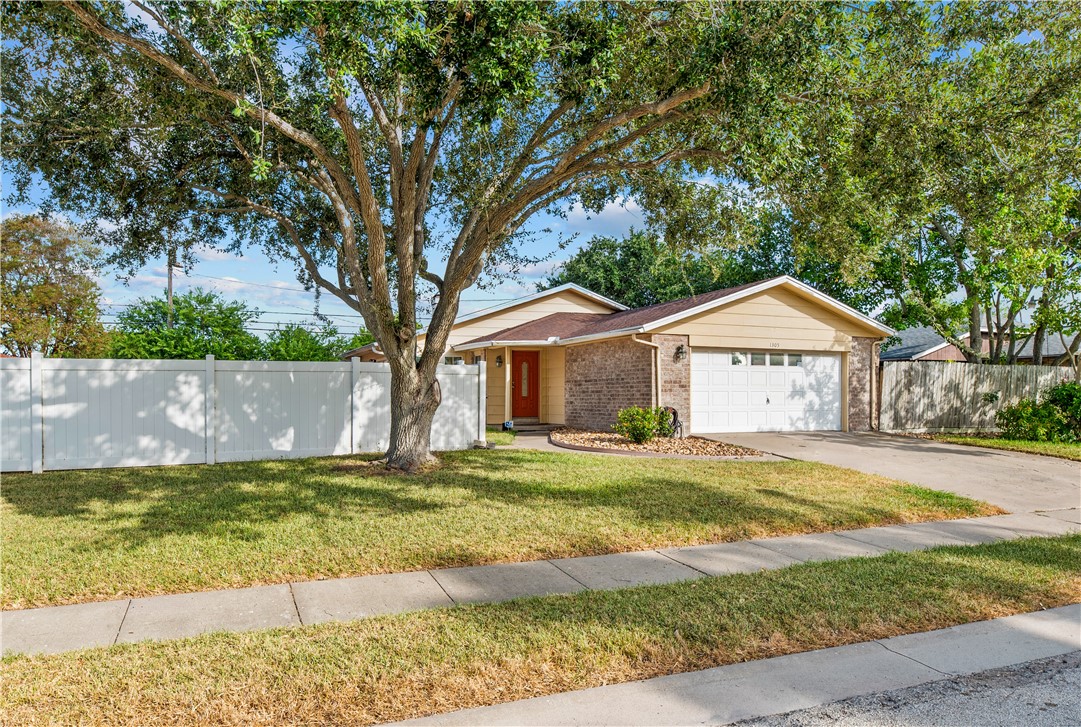 1305 Harbor Lights Drive Corpus Christi, TX 78412 - Photo 30 of 31 a front view of a house with a yard