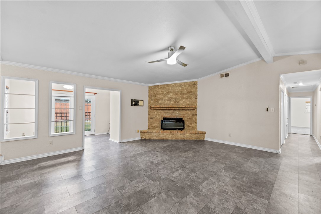 1305 Harbor Lights Drive Corpus Christi, TX 78412 - Photo 5 of 31 an empty room with windows and fireplace