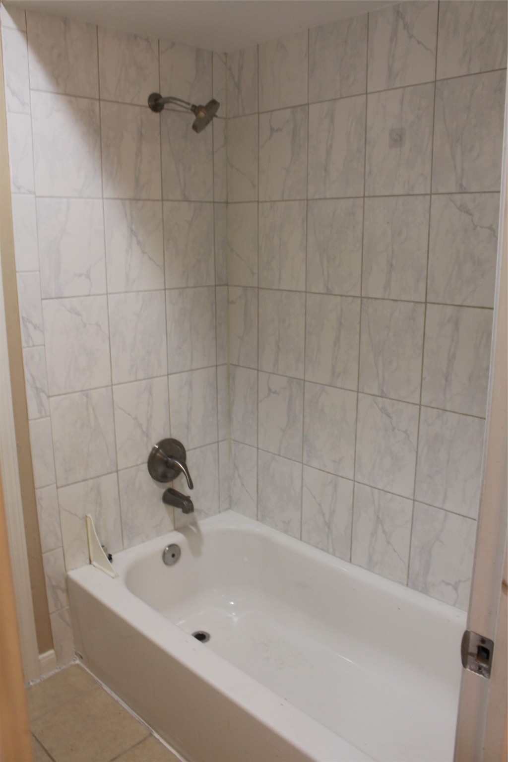 16111 Aspenglenn Drive, Unit 1001 Houston, TX 77084 - Photo 12 of 17 a bathroom with a tub