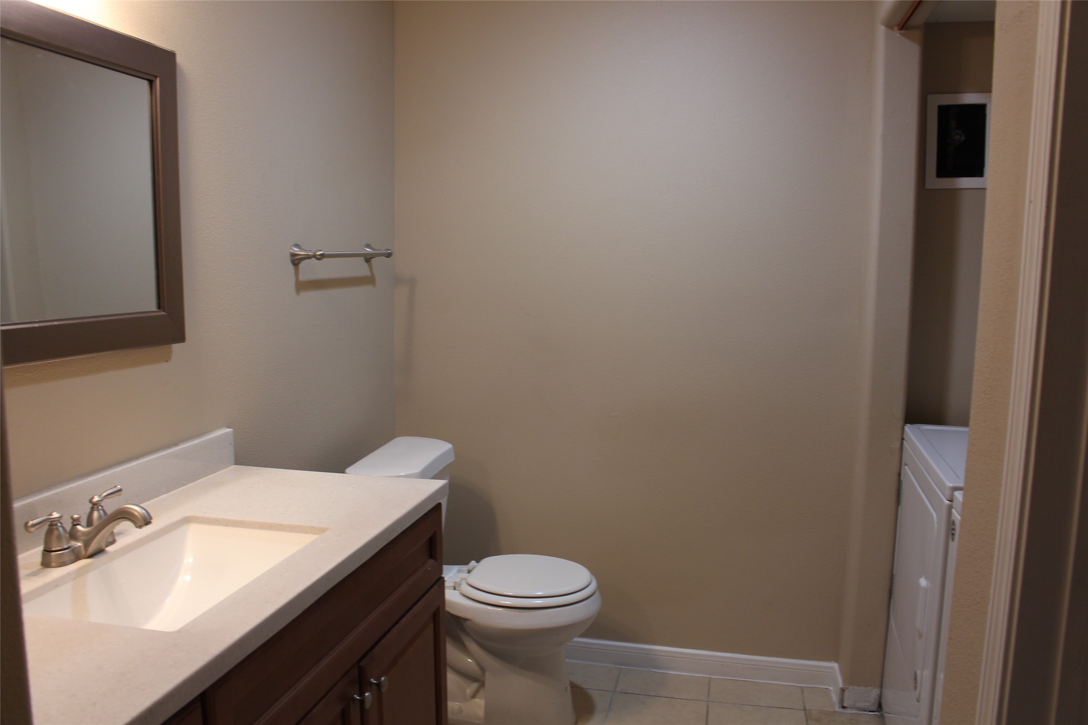 16111 Aspenglenn Drive, Unit 1001 Houston, TX 77084 - Photo 14 of 17 a bathroom with a granite countertop toilet and sink