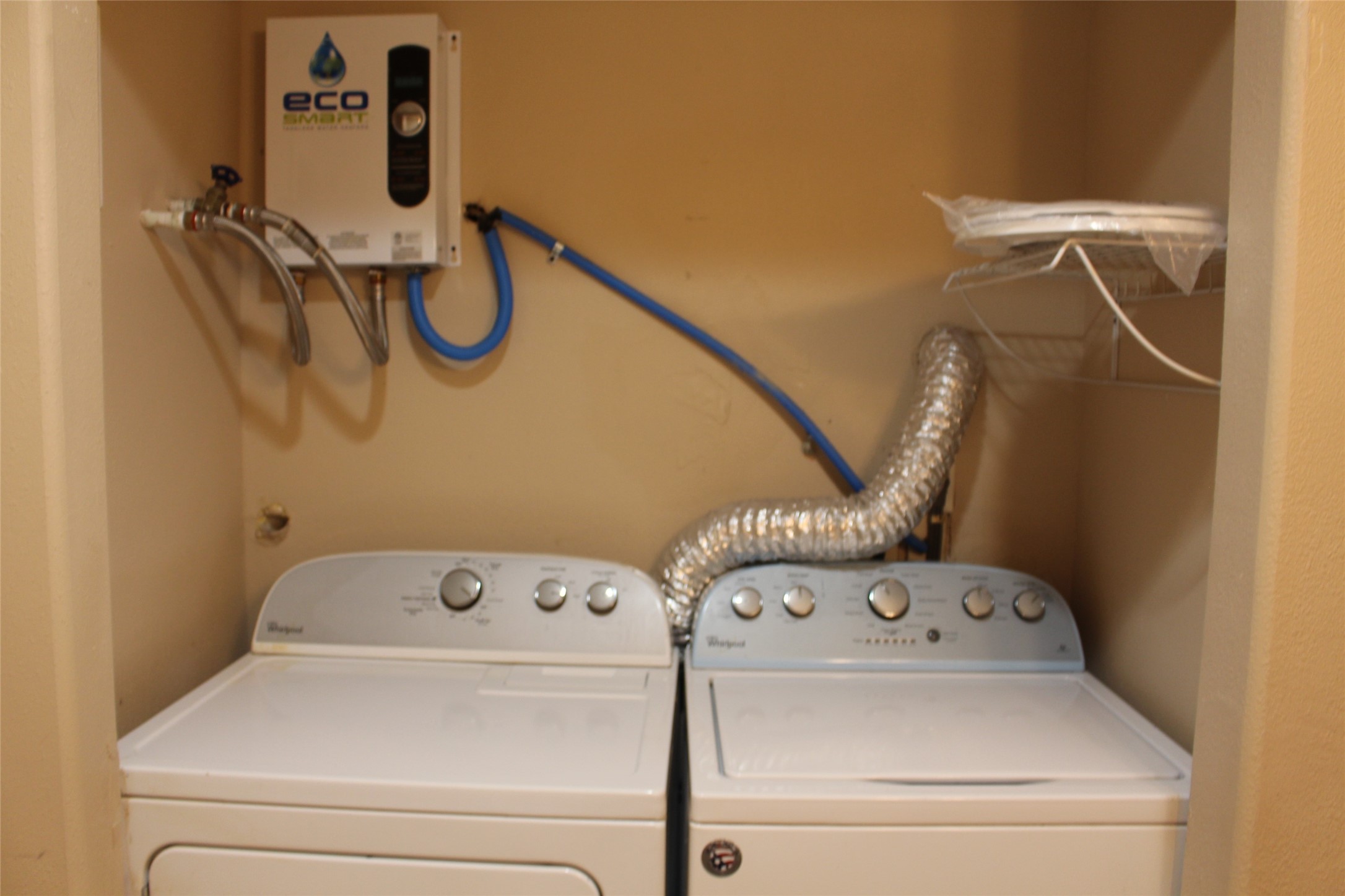 16111 Aspenglenn Drive, Unit 1001 Houston, TX 77084 - Photo 15 of 17 a utility room with dryer and washer