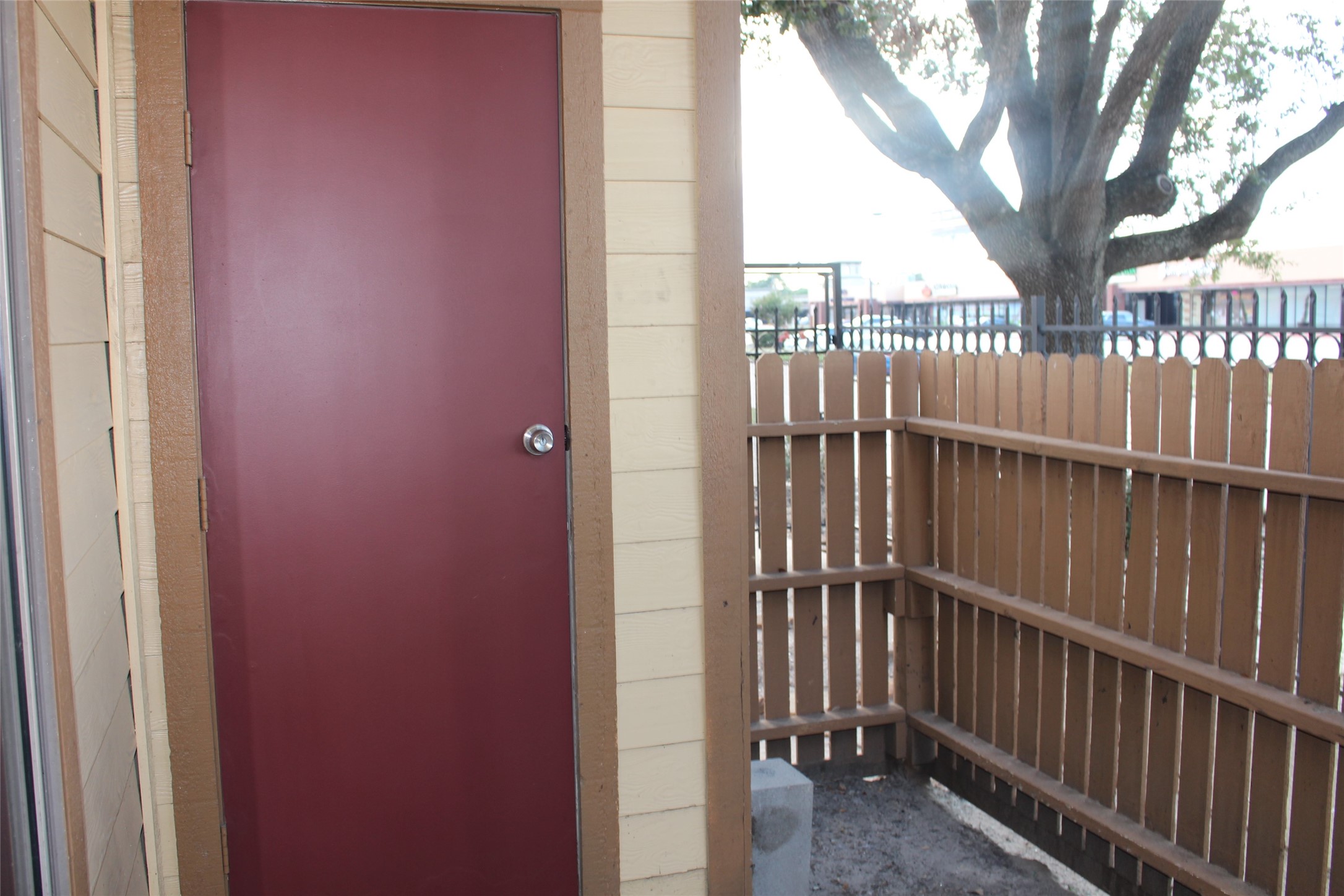 16111 Aspenglenn Drive, Unit 1001 Houston, TX 77084 - Photo 16 of 17 a view of a balcony with wooden fence and floor