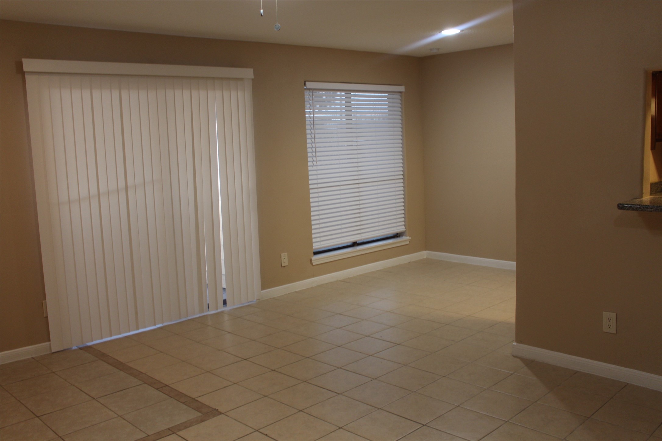 16111 Aspenglenn Drive, Unit 1001 Houston, TX 77084 - Photo 5 of 17 an empty room with windows
