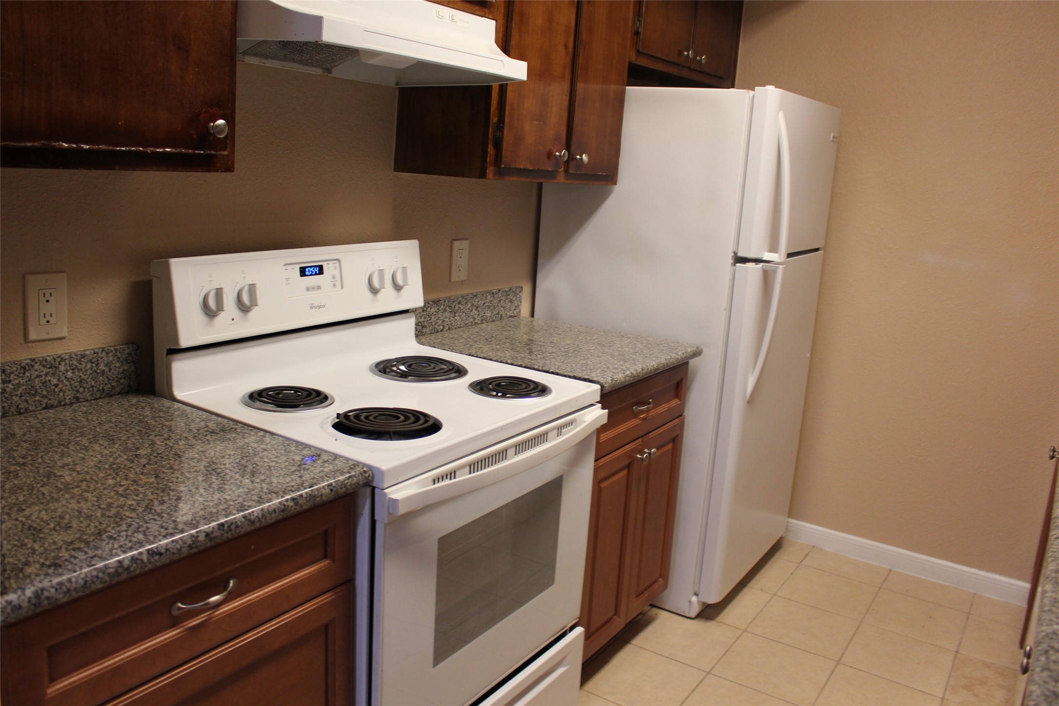 16111 Aspenglenn Drive, Unit 1001 Houston, TX 77084 - Photo 8 of 17 a white stove top oven sitting inside of a kitchen