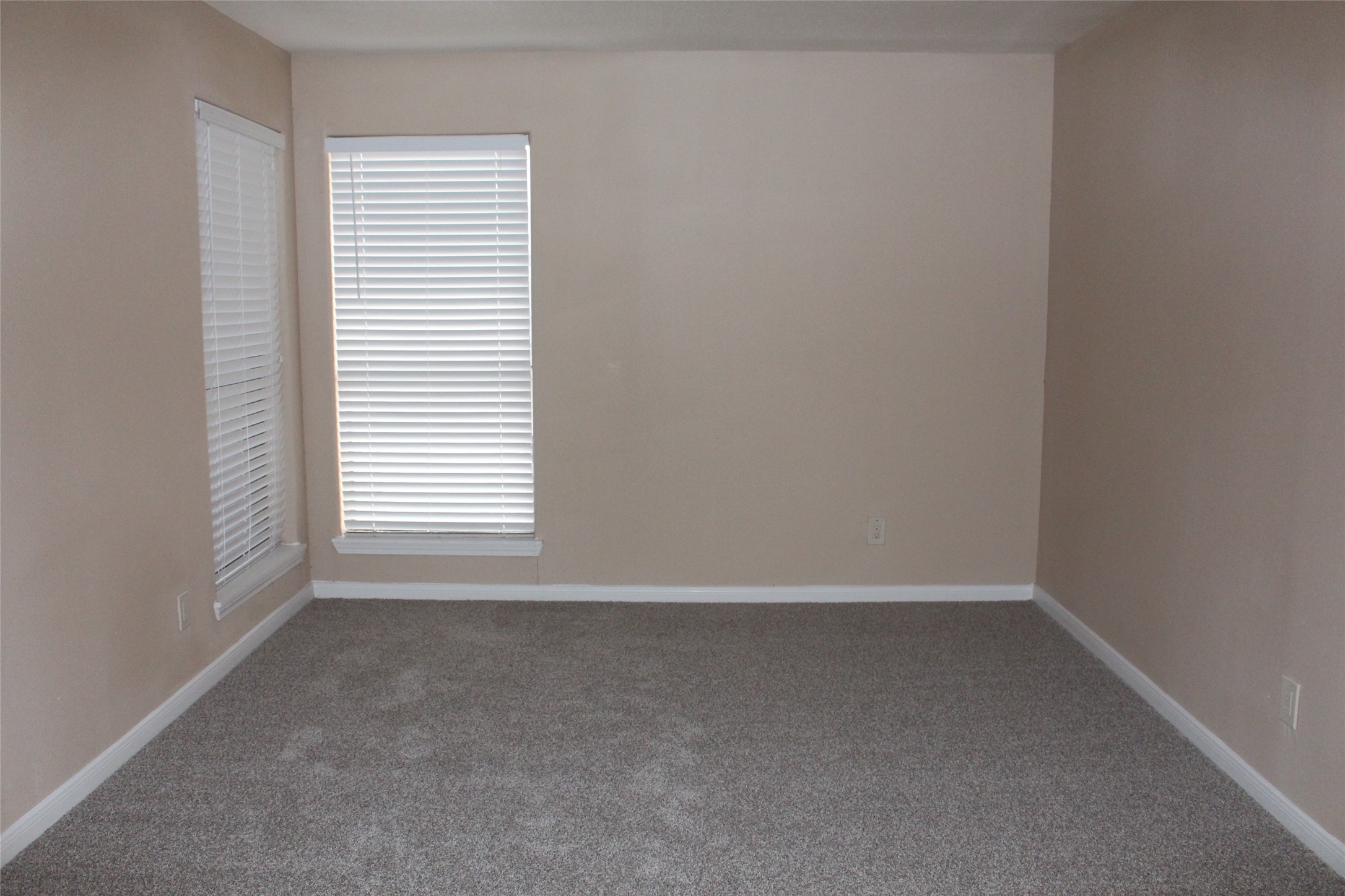 16111 Aspenglenn Drive, Unit 1001 Houston, TX 77084 - Photo 10 of 17 a view of an empty room with a window