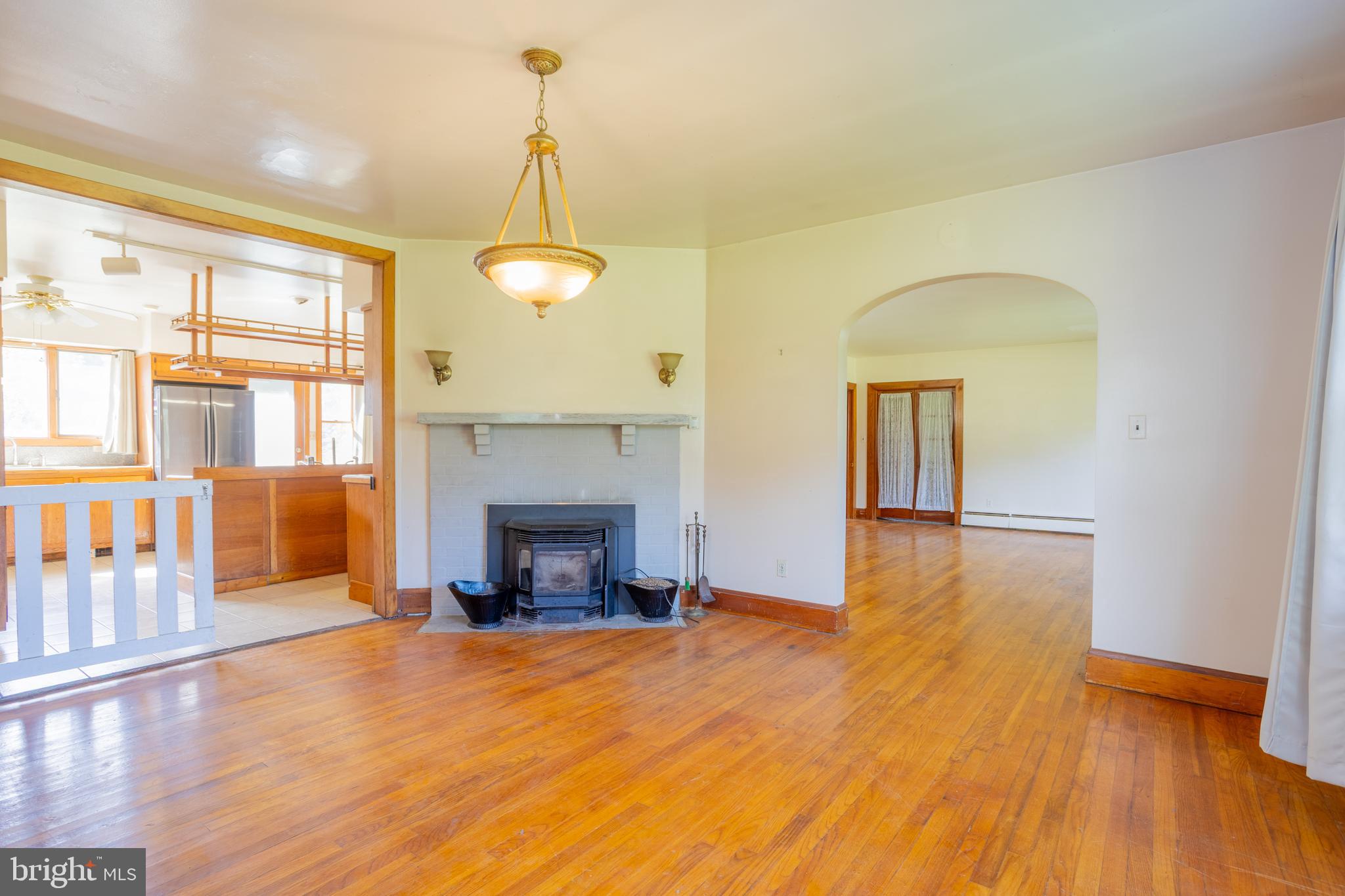 1929 Stockton Road Phoenix, MD 21131 - Photo 22 of 46 a view of empty room with wooden floor and fireplace
