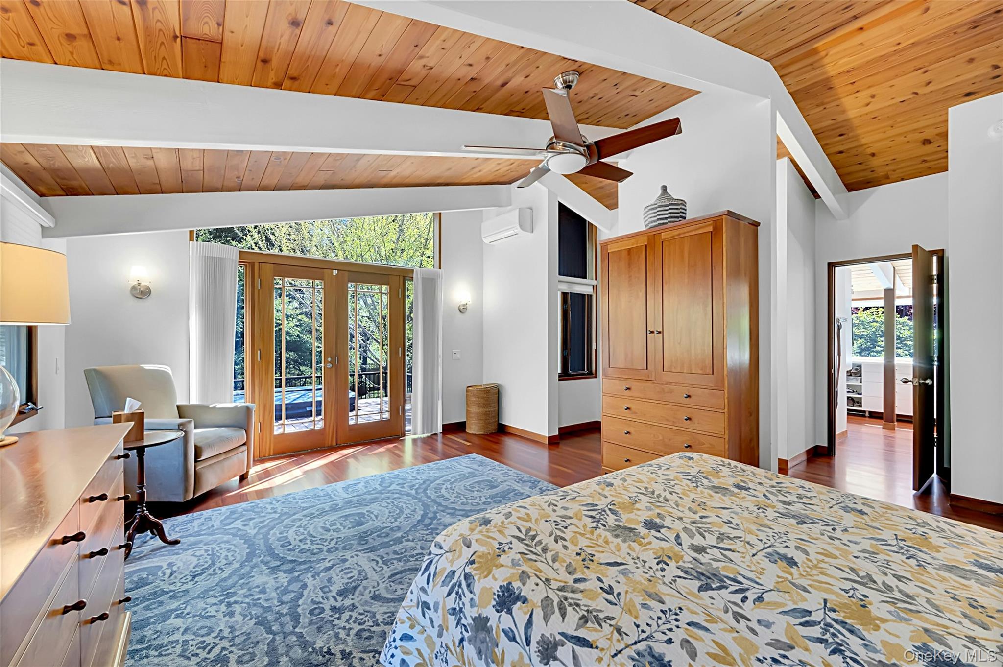 120 Kitchawan Road Pound Ridge, NY 10576 - Photo 19 of 40 a bedroom with a bed and wooden floor